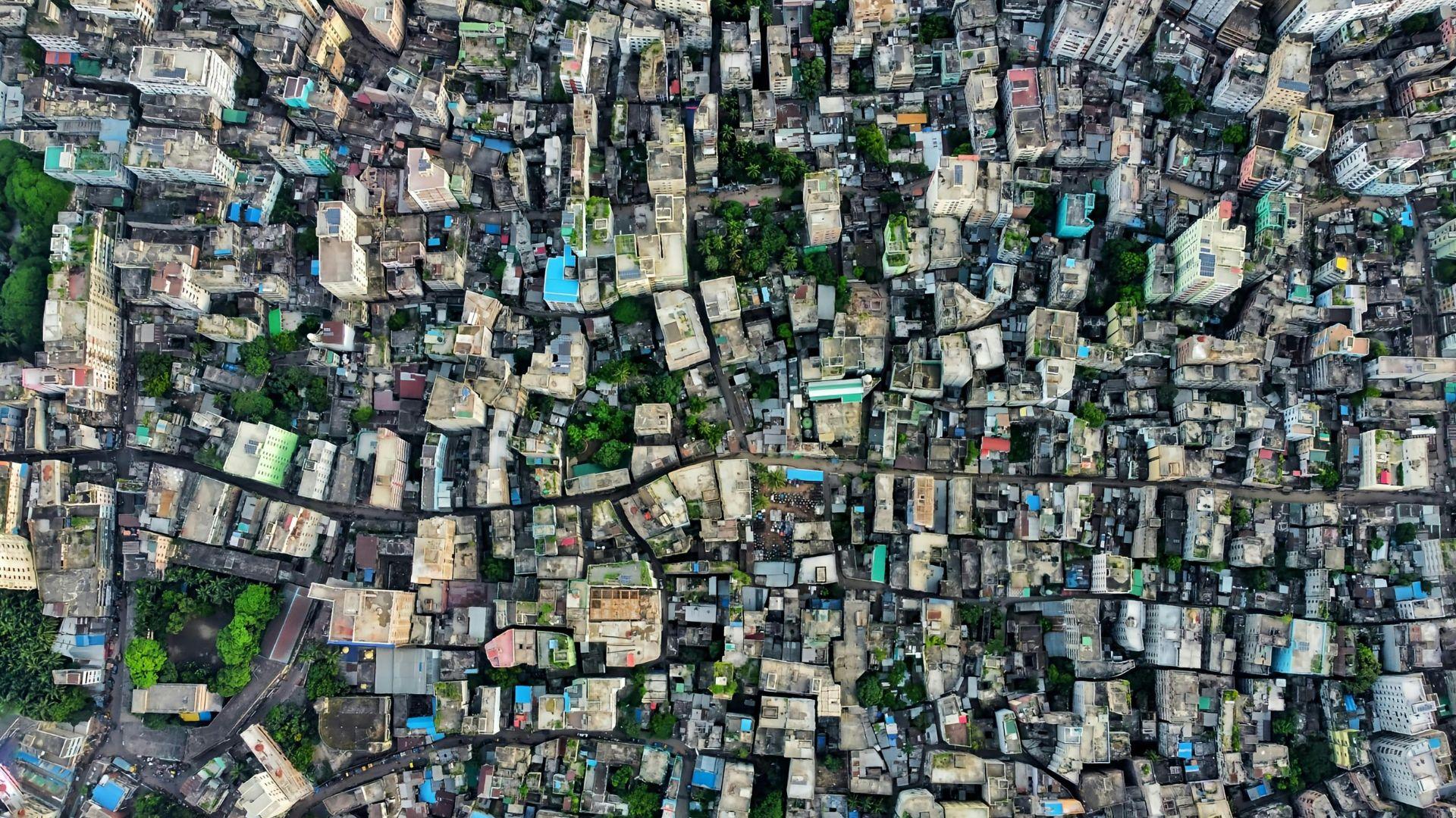 Aerial drone view of dense city housing. The conditions data is collected in.